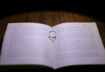 일상 속 정신건강 지키기, 작은 루틴이 큰 변화를 만든다 white book page on brown wooden table