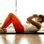 “일상 속 근육 키우기, 작은 변화로 건강 지키세요” woman exercising indoors